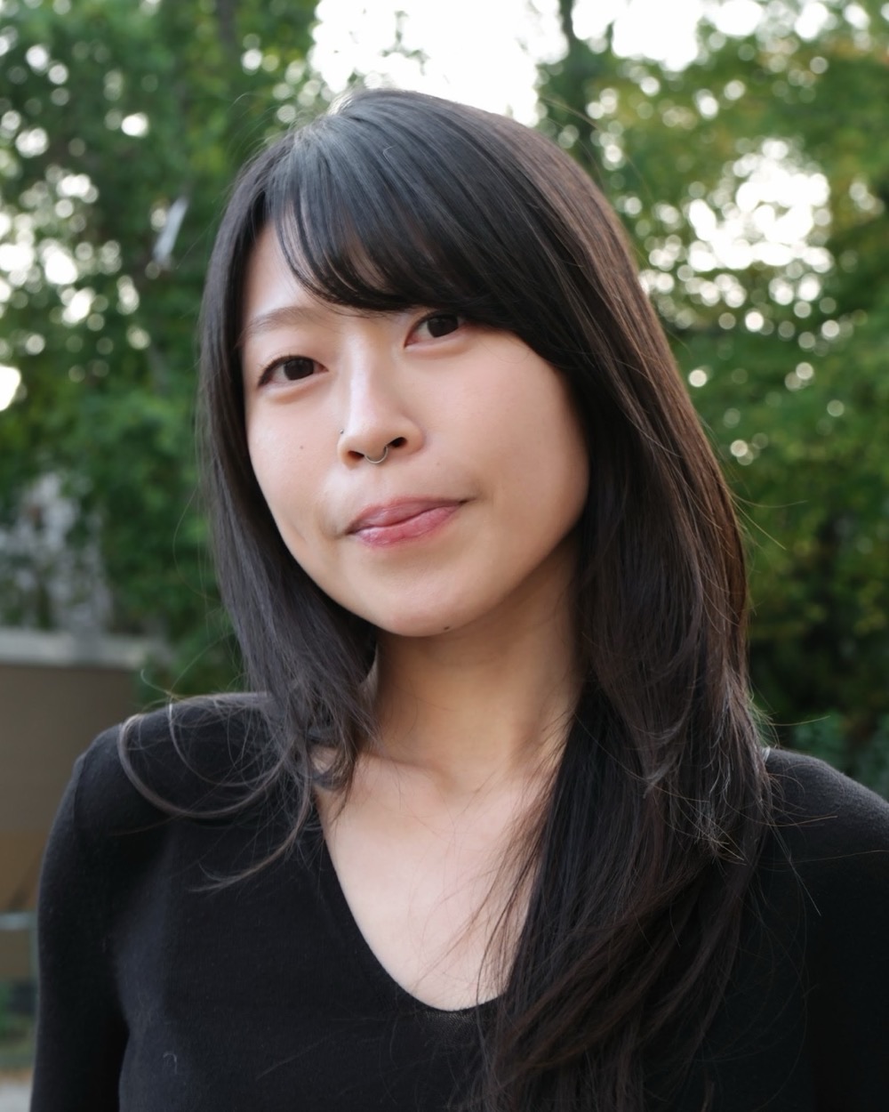 Portrait of Simone Wong, outdoors among trees